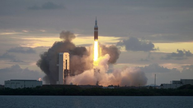 The Delta IV Heavy rocket with the Orion spacecraft lifts off from the Cape Canaveral Air Force Station.