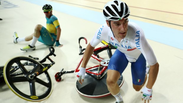 Elia Viviani of Italy and Glenn O'Shea of Australia crash in the omnium.