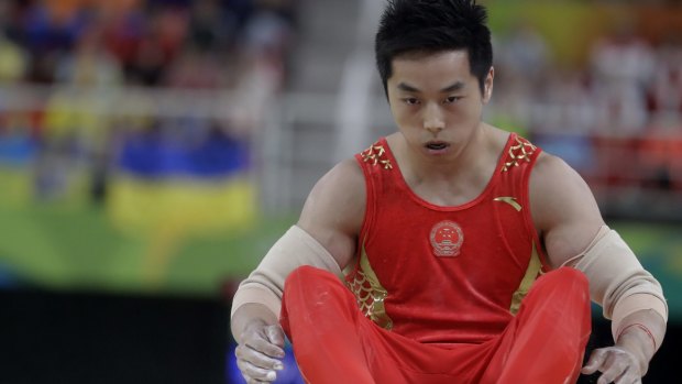 Heavy fall: gymnast You Hao tumbled from the parallel bars, and China did not win a single gymnastics gold medal in Rio