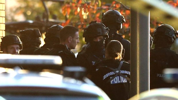 Police at the scene of a hostage situation at Bermuda Park in Nuneaton, central England.