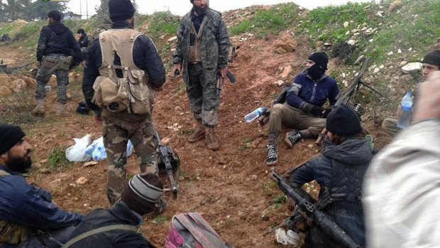 Control: Nusra Front fighters resting after clashes with Syrian troops in Wadi Deif in Syria.