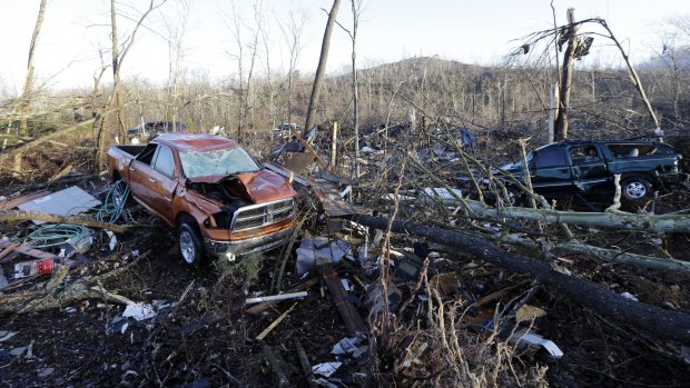 Vehicles and debris are scattered in an area near Linden, Tennessee.