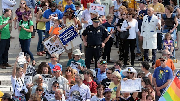 Protesters head into the Legislative building for a sit-in against House Bill 2 in Raleigh last month.