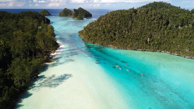 Paddling the shallows of Wayag Island in northern Raja Ampat.