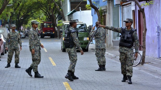 Maldives National Defence Force personnel patrol the streets after a state of emergency was declared in Male, Maldives, on Wednesday.
