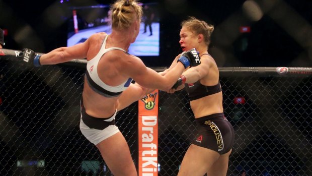 Too good: Holly Holm aims a kick at Ronda Rousey in Melbourne in November.