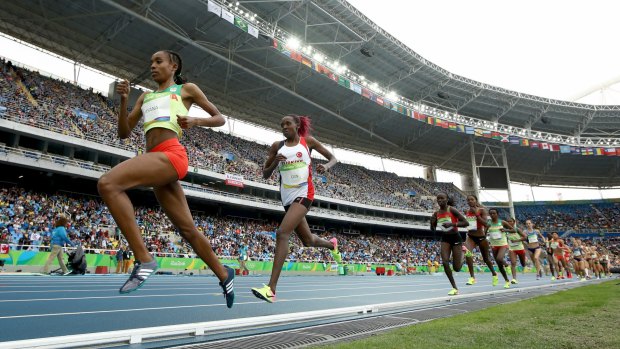 Leading the pack: Almaz Ayana speeds around the track.