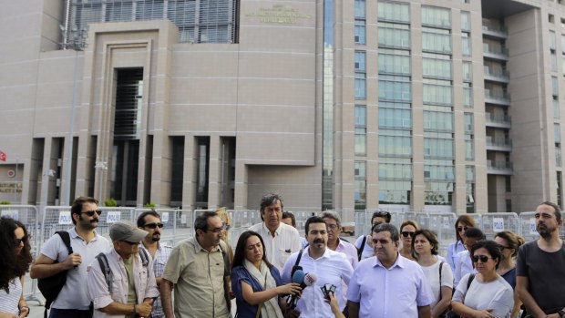Journalists gather outside court to support their colleague Bulent Mumay, detained on Tuesday.