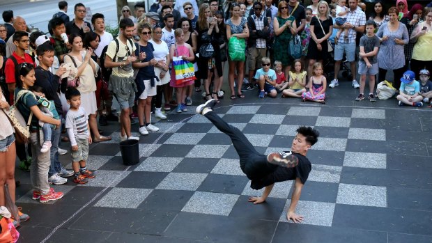 We're the best: a member of the Young Masters break-dancing crew wows the crowd in Swanston Street on Tuesday.