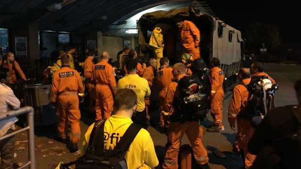 British search and rescue workers load a truck in  with specilaist equipment at Tribhuvan International Airport, Kathmandu.