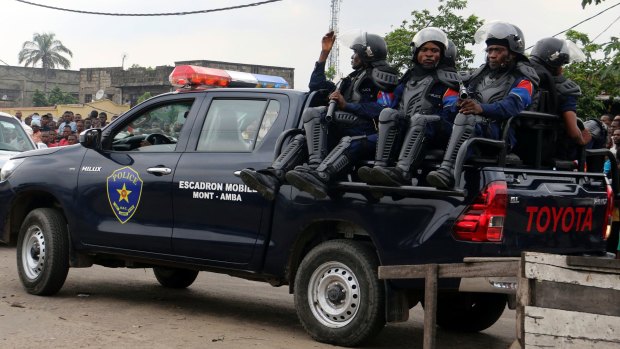 Congolese police patrol outside the main prison in Kinshasa, Congo.