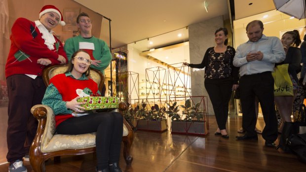 Say cheese! Kayla Wilson, Ben Puxley, Scott Puxley. Pose for their awkward Christmas photo.