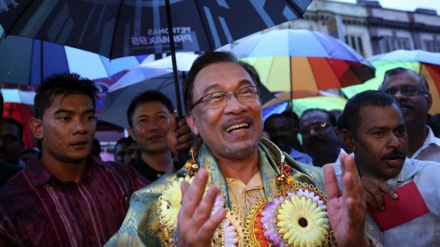 Malaysia's opposition leader Anwar Ibrahim sings on a street in Klang, near Kuala Lumpur, as part of a campaign to seek support ahead of his final appeal against a conviction for sodomy. 