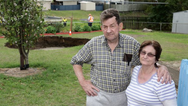 Residents Ray and Lynn McKay after a massive sinkhole opened in the backyard of their Ipswich home.