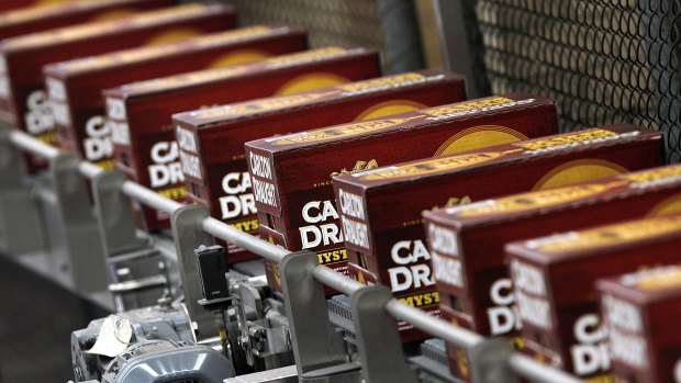 Slabs of Carlton Draught move along a conveyer belt at the giant Abbotsford brewery.