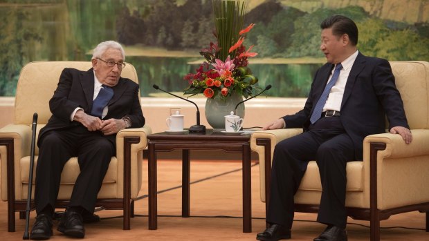 Former US Secretary of State Henry Kissinger, left, meets China's President Xi Jinping at the Great Halll of the People in Beijing on December 2.