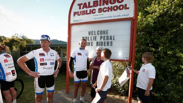 Formerprime minister Tony Abbott is greeted by supporters at the Talbingo Public School.