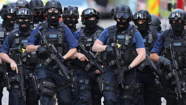 Counter-terrorism officers in London after the attack.