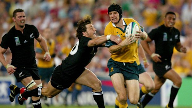 Rugby World Cup Semi Final  Australia v New Zealand; Telstra Stadium  Pic shows Byron Kelleher lunging at Steve Larkham at Telstra Stadium.  15th November 2003.   Photograph by Craig Golding/csg.  SPECIALX 21776