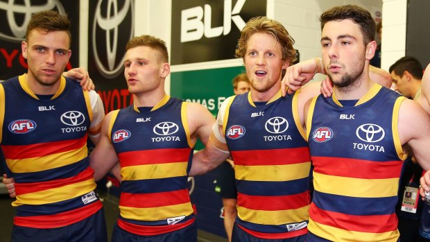 The Crows sing the team song after a win.