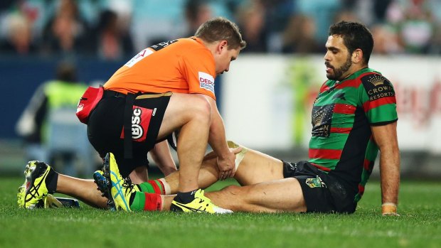 Concern: Souths star Greg Inglis receives treatment during Friday's match against Canterbury before being forced to leave the field.