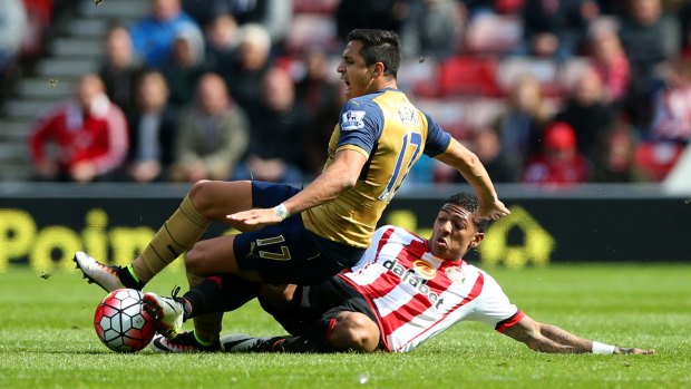 Arsenal's Alexis Sanchez is challenged by Sunderland's Patrick van Aanholt in a lively draw at the Stadium of Light.