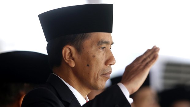 Indonesia's President Joko Widodo has backed the decision of his armed forces chief to suspend military co-operation but instructed him to resolve the situation.