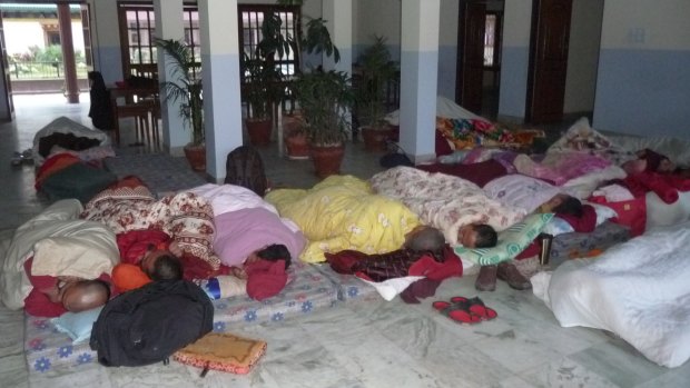 Members of the International Buddhist Academy sleep together after rooms were destroyed by the Nepal earthquakes.