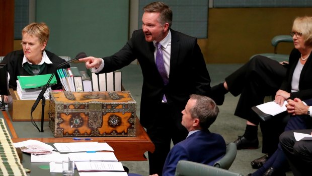 Shadow treasurer Chris Bowen moves a motion during question time.