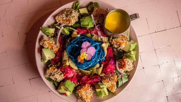 The rainbow salad is a simple salad under a superfood strata. 
