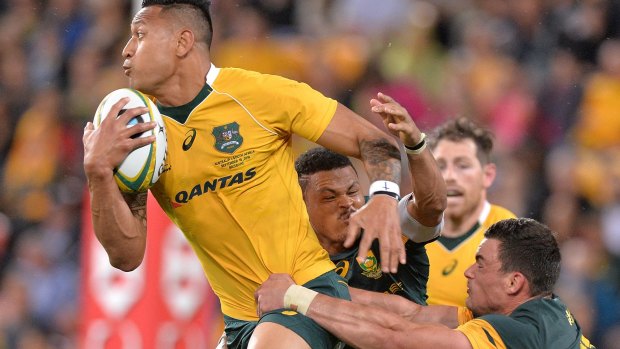 Shackled: Israel Folau attempts to break away from the Boks' defence.