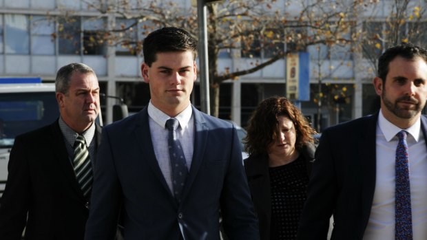 ADFA cadet Jack Toby Mitchell, second from left, arrives at the ACT Supreme Court with his parents last week.