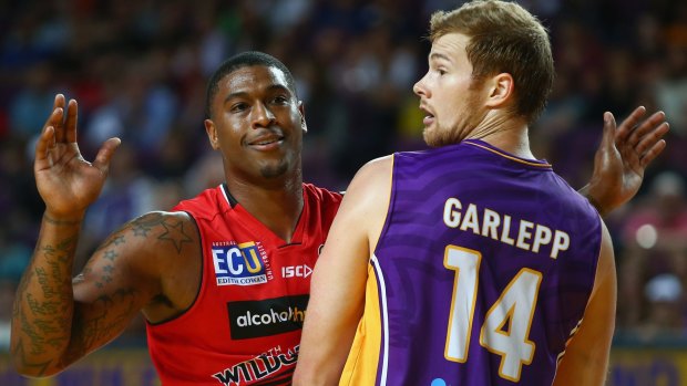 Bad blood: The Wildcats' Earnest Ross and Tom Garlepp of the Sydney Kings size each other up.