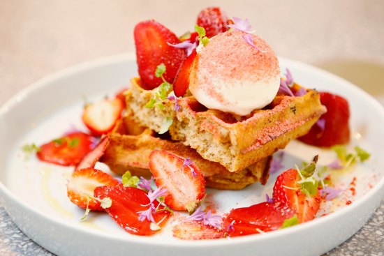 Coffee waffles with fresh, freeze-dried and  macerated strawberries.