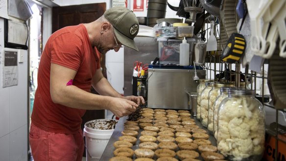 Flower Drum bakery co-owner Johnny Ageletos has tripled the number of fruit mince pies, puddings and Christmas cakes he's making this year.