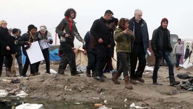 British Labour Party leader Jeremy Corbyn, second right, visits the migrant encampment in Calais, northern France, on Saturday.