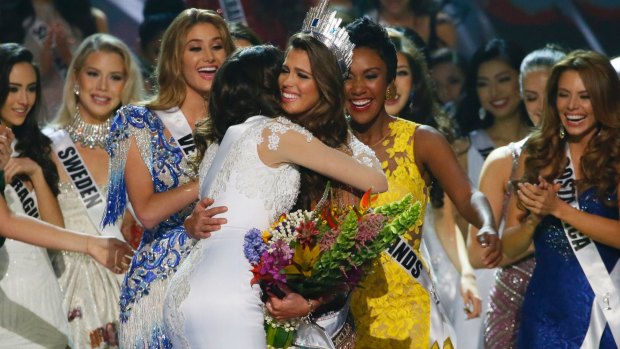 Iris Mittenaere, centre right, of France is congratulated by fellow contestants after being proclaimed the Miss Universe.