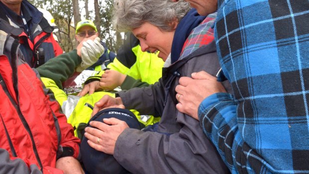 Luke Shambrook is kissed by his mother after being found alive in bush near Eildon.