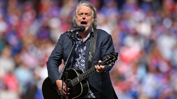 Mike Brady performs One Day in October during the 2016 AFL Grand Final.