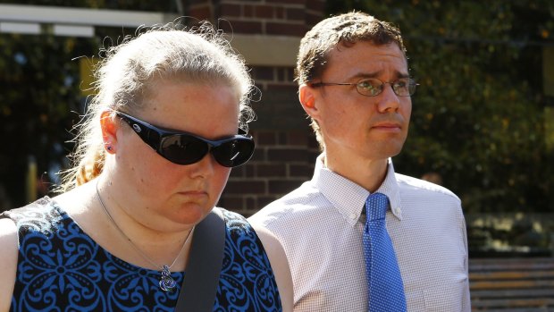 Carl Harrap leaves Manly Local Court holding hands with a woman.