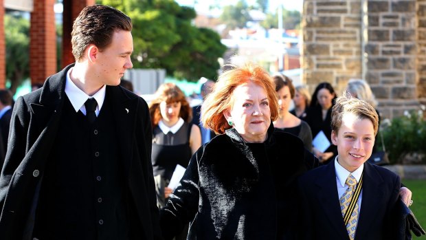 Eileen Bond, the late Alan Bond's former wife, walks with family into the funeral service at St Patrick's Basilica in Perth.