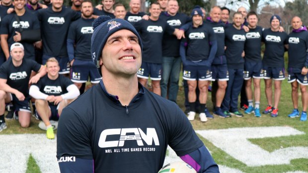 356 and counting: Cameron Smith poses with teammates during a celebration of his NRL games record at Gosch's Paddock in Melbourne.