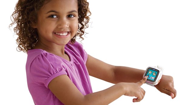 A child poses with VTech's Kidizoom smartwatch.