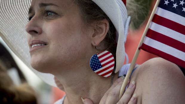 Things white people feel: rage. A Los Angeles woman listens to a speaker during a Tea Party Patriots rally.
