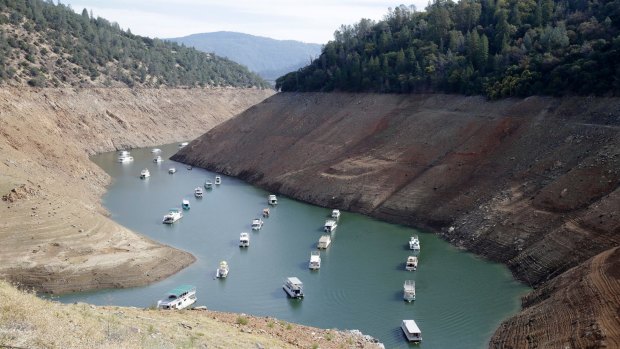 Houseboats sit in the drought lowered waters of Oroville Lake in 2014.