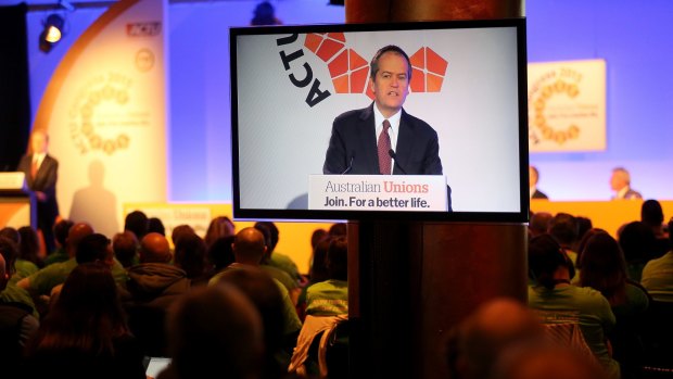 Bill Shorten, seen speaking at the ACTU Congress in 2015, will be under pressure from the union movement to undo business tax cuts.