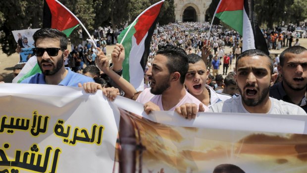 Demonstrators on the compound known to Muslims as the Noble Sanctuary and to Jews as Temple Mount in Jerusalem's Old City on Friday marked the 48th anniversary of the 1967 Middle East war, when Israel captured East Jerusalem, the Gaza Strip, the West Bank and Golan Heights. 