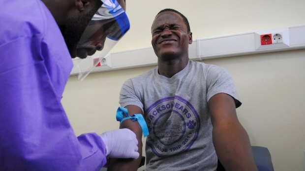 The blood of a survivor of the Ebola virus is extracted as part of a study launched at Liberia's John F. Kennedy Hospital in Monrovia, Liberia this month.