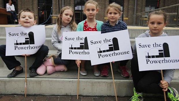 Children from the Webb and Carter families hold signs at the Save The Powerhouse Rally in 2015.