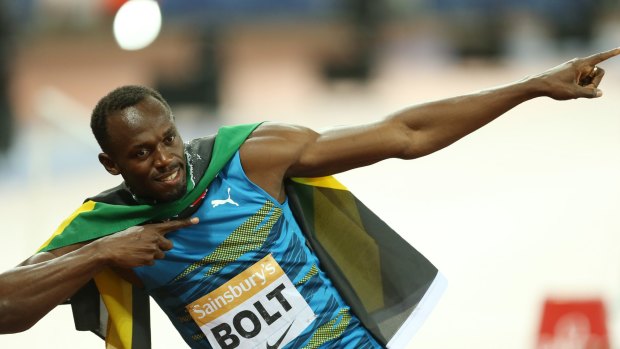 Usain Bolt celebrates with his trademark thunderbolt.